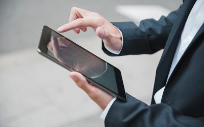 close-up-businessman-s-hand-using-digital-tablet